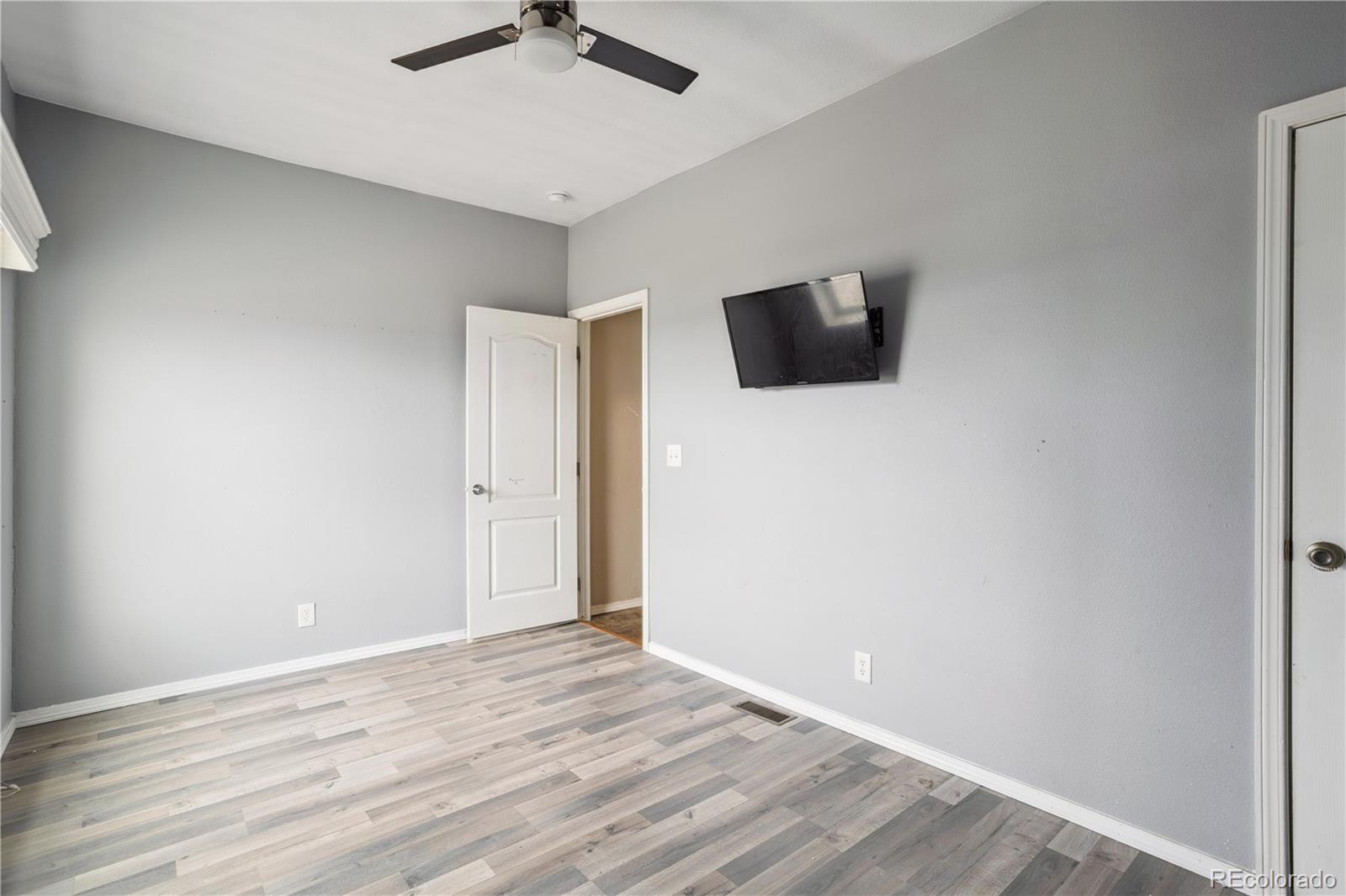 125 12th Street Fairplay, CO 80440 - Photo 21 of 31 a view of an empty room with wooden floor and a window