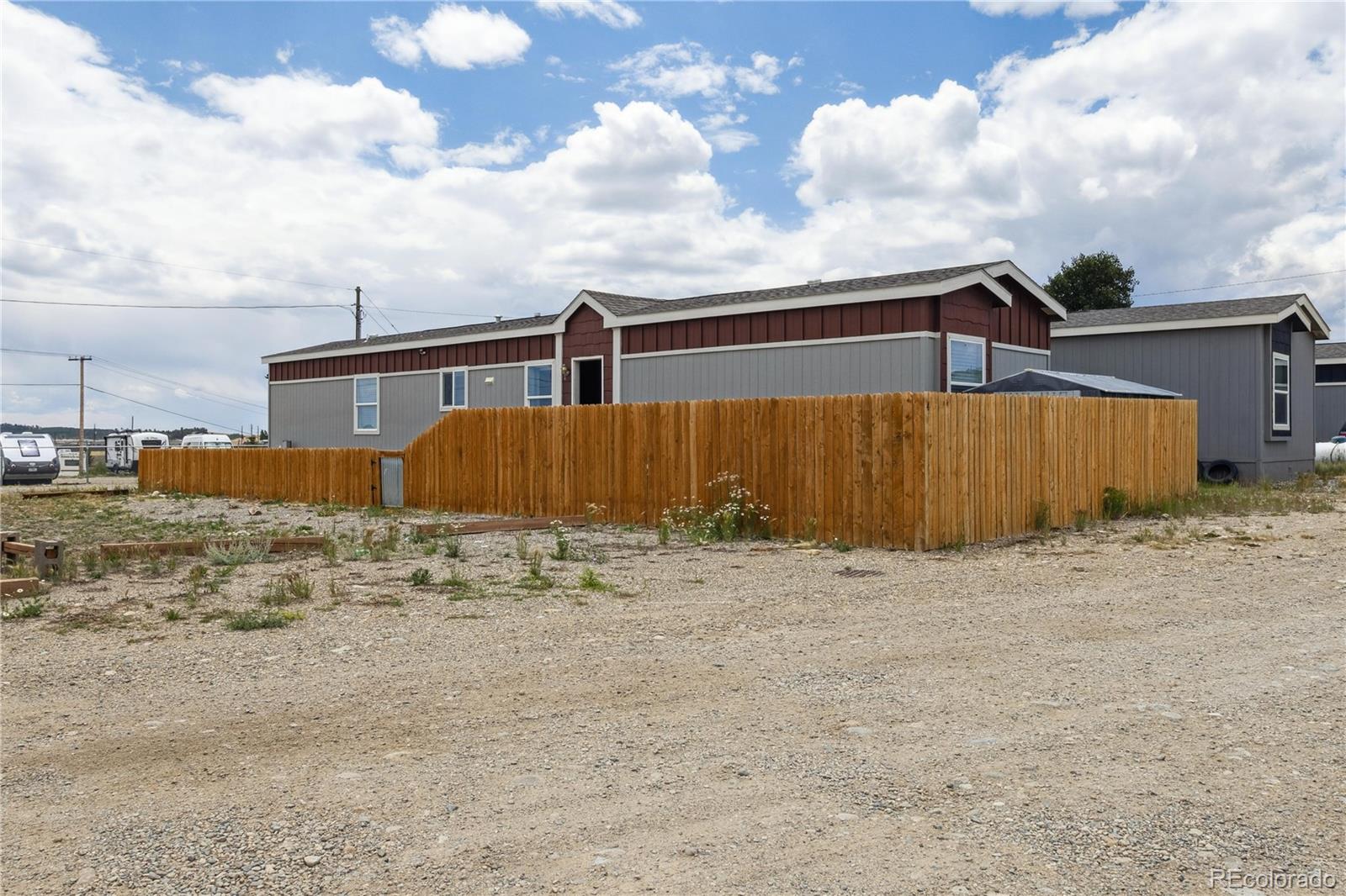 125 12th Street Fairplay, CO 80440 - Photo 4 of 31 a street view with wooden fence