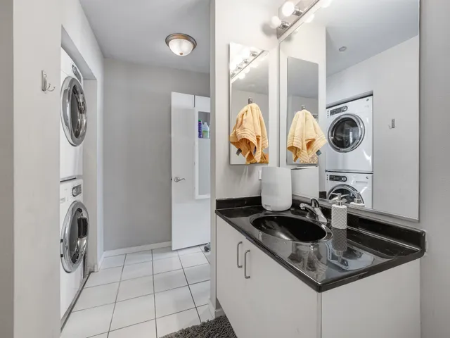 a kitchen with stainless steel appliances granite countertop a sink and a stove