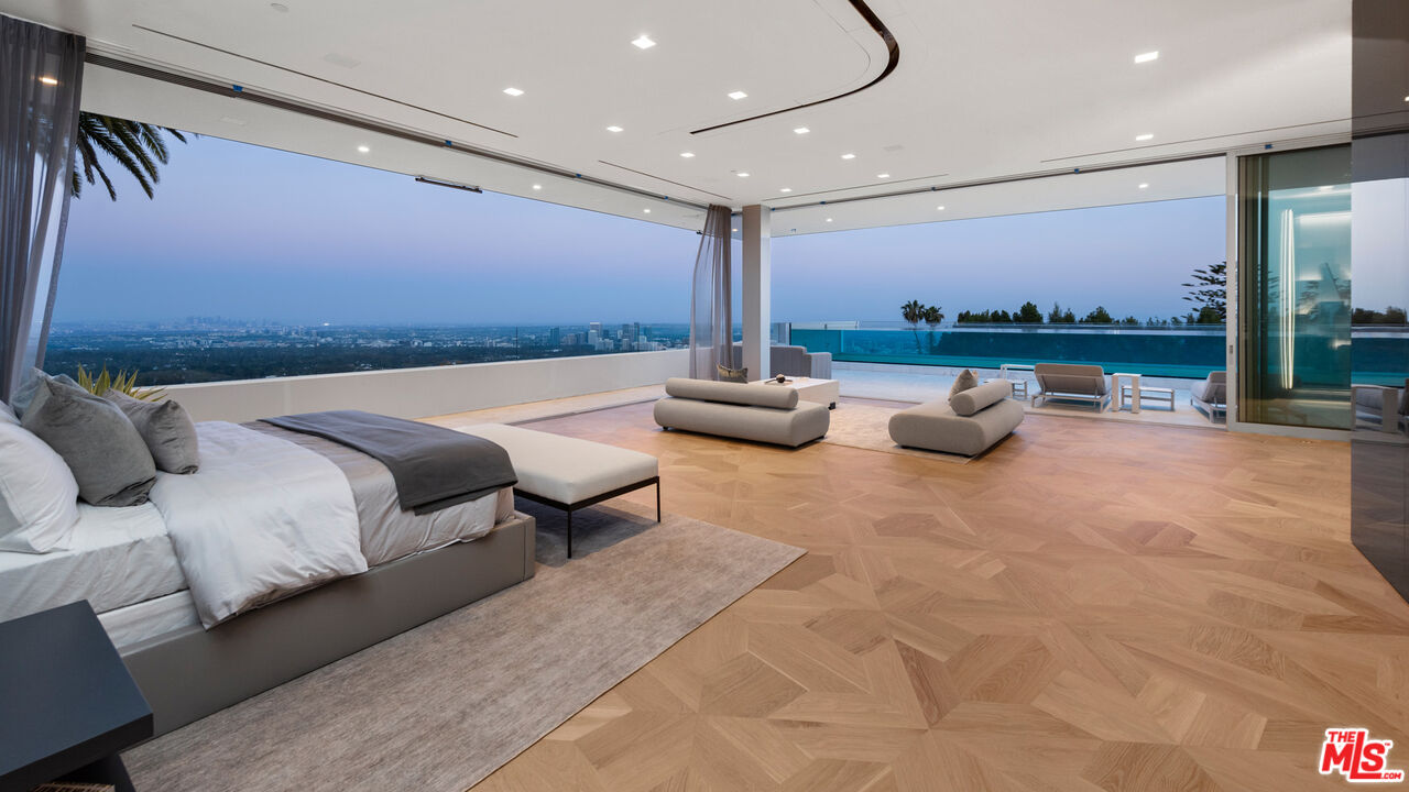 944 Airole Way Los Angeles, CA 90077 - Photo 11 of 30 a bedroom with furniture and a view