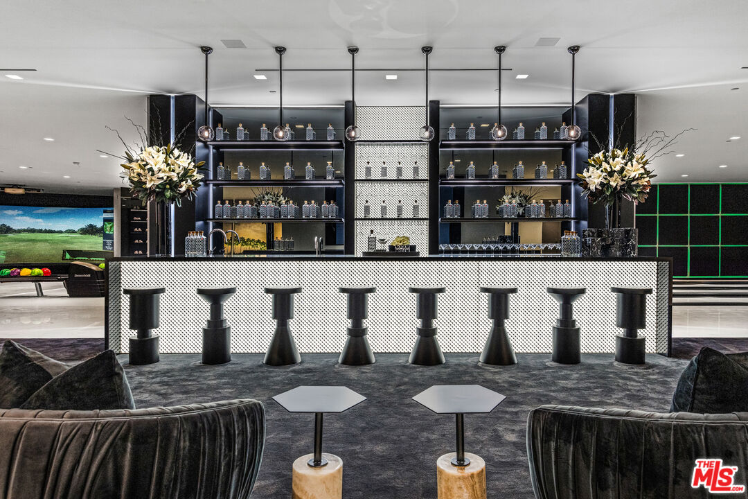 944 Airole Way Los Angeles, CA 90077 - Photo 15 of 30 a kitchen with stainless steel appliances granite countertop a sink and a refrigerator