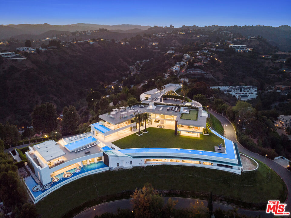 944 Airole Way Los Angeles, CA 90077 - Photo 2 of 30 an aerial view of a house with a swimming pool