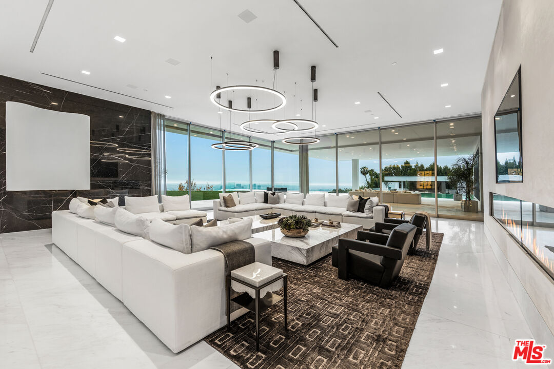 944 Airole Way Los Angeles, CA 90077 - Photo 5 of 30 a living room with furniture and a large window