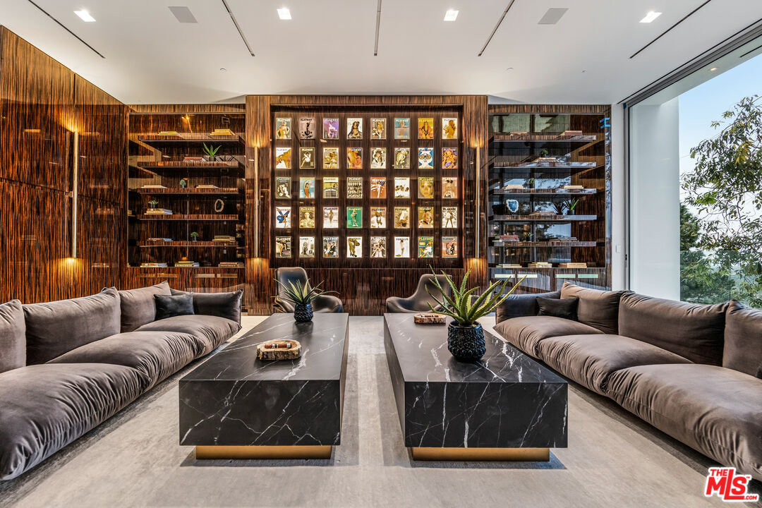 944 Airole Way Los Angeles, CA 90077 - Photo 9 of 30 a living room with furniture and a potted plant