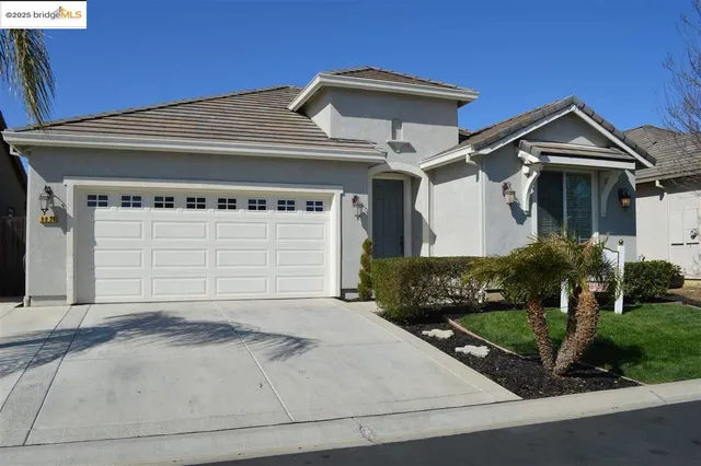 a front view of a house with a garage