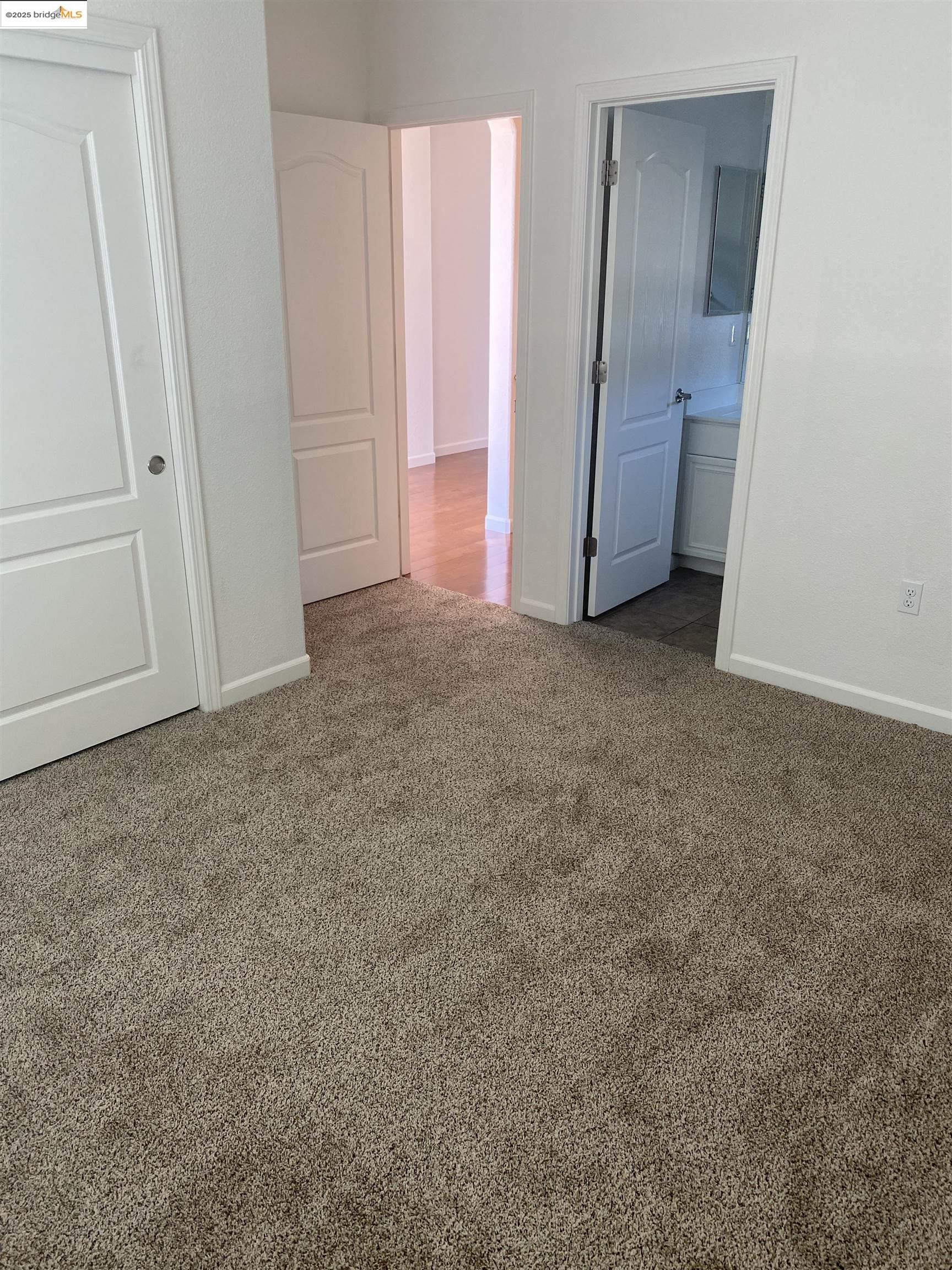 9821 Key W Way Discovery Bay, CA 94505 - Photo 11 of 14 an empty room with an entrance to other room