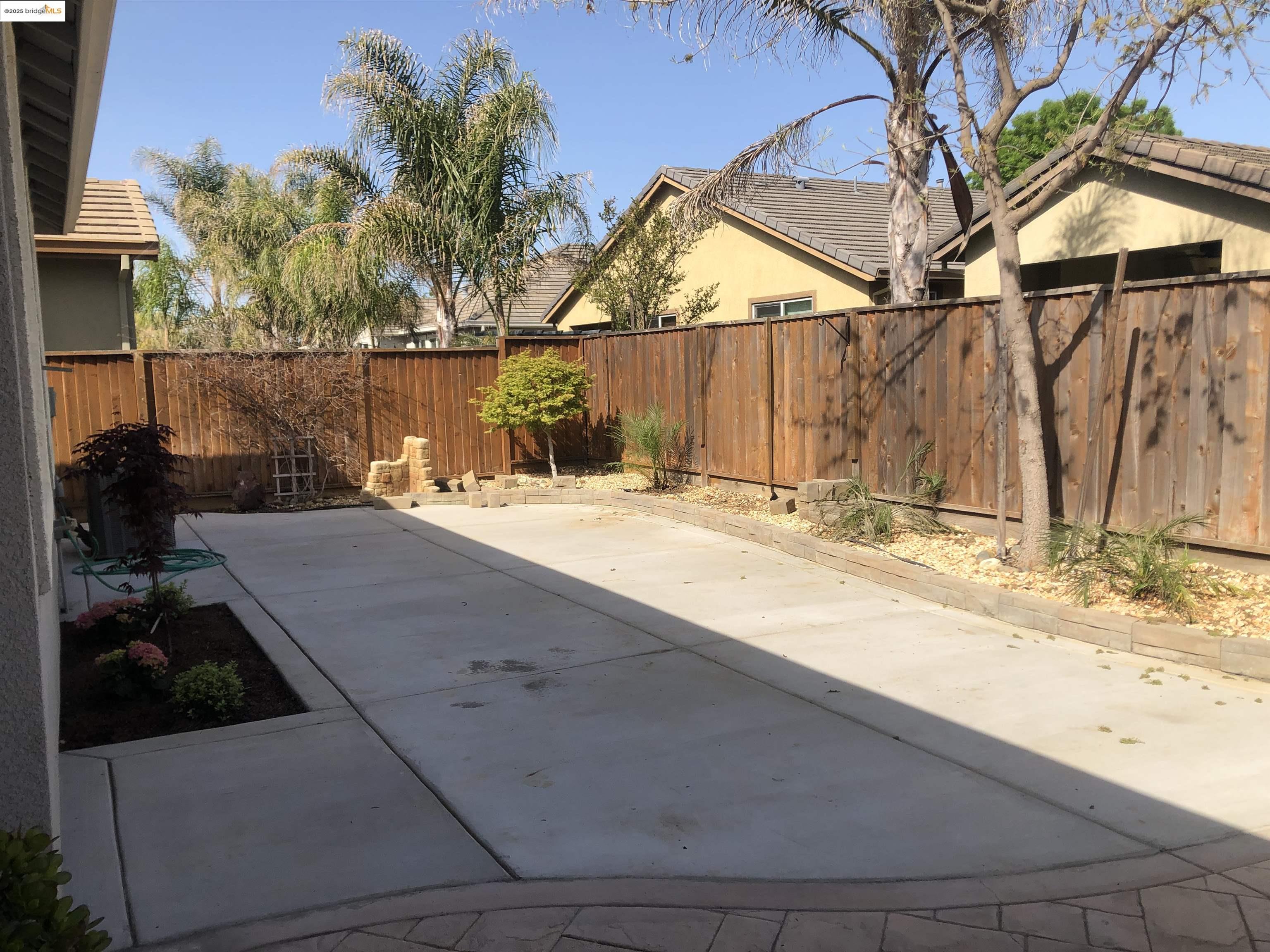 9821 Key W Way Discovery Bay, CA 94505 - Photo 13 of 14 a backyard of a house