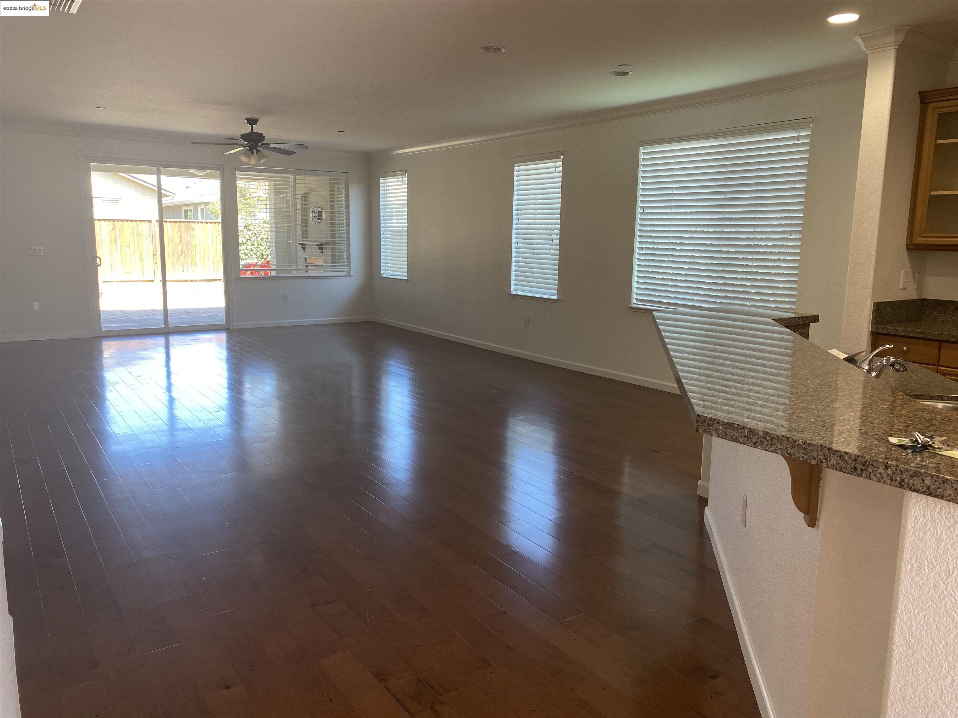9821 Key W Way Discovery Bay, CA 94505 - Photo 2 of 14 wooden floor in an empty room with a window