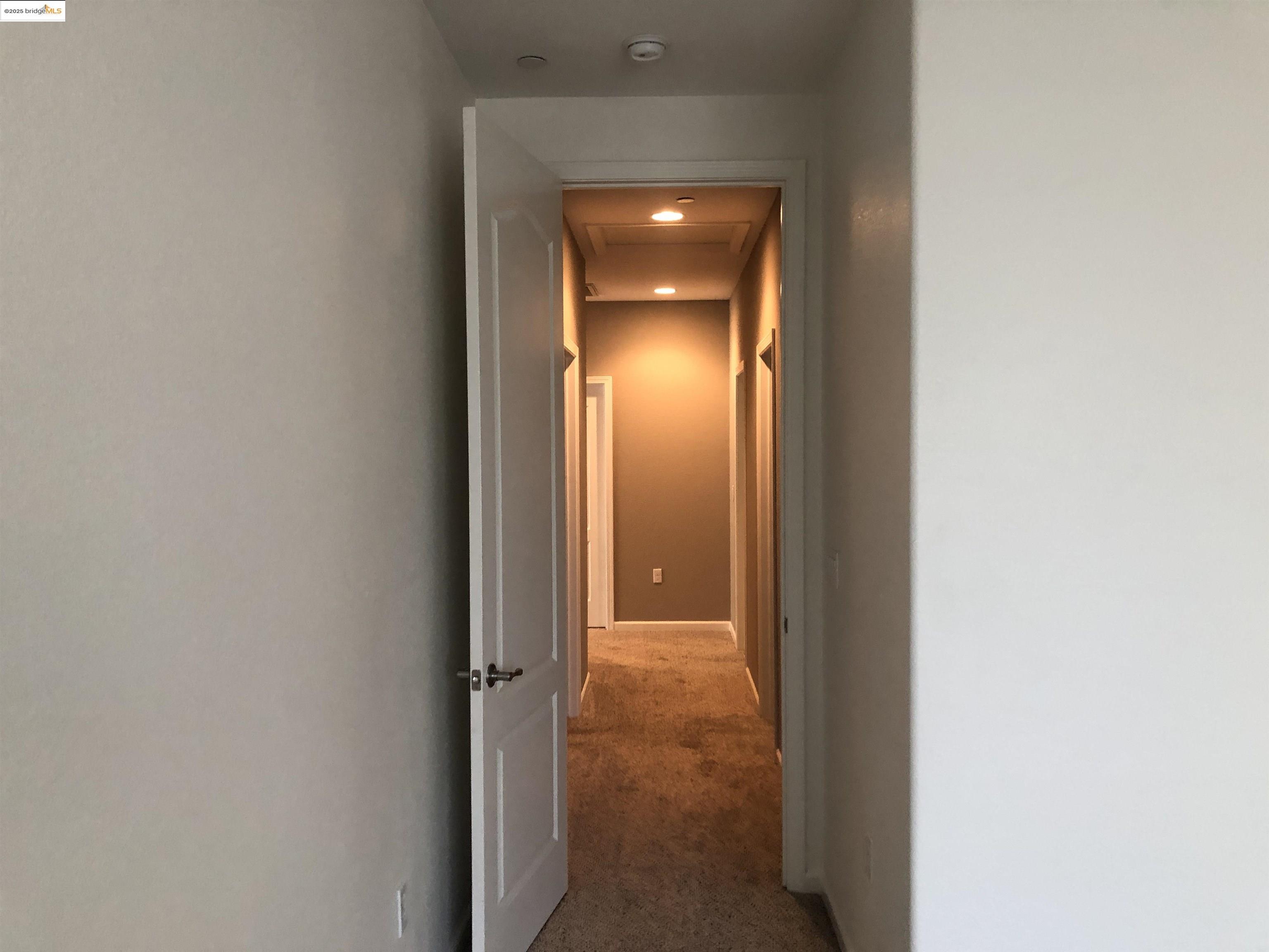 9821 Key W Way Discovery Bay, CA 94505 - Photo 6 of 14 a view of a hallway with a wooden door