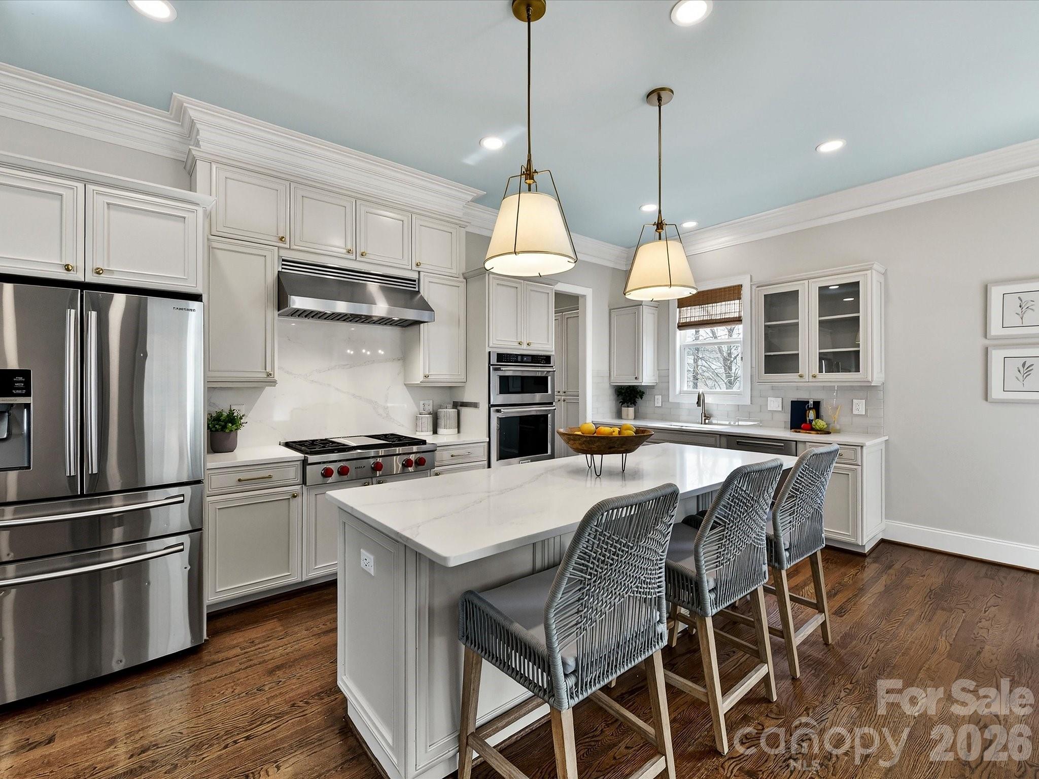 10030 Triple Oak Road Charlotte, NC 28277 - Photo 14 of 48 a kitchen with stainless steel appliances granite countertop a stove a refrigerator a kitchen island a sink and white cabinets
