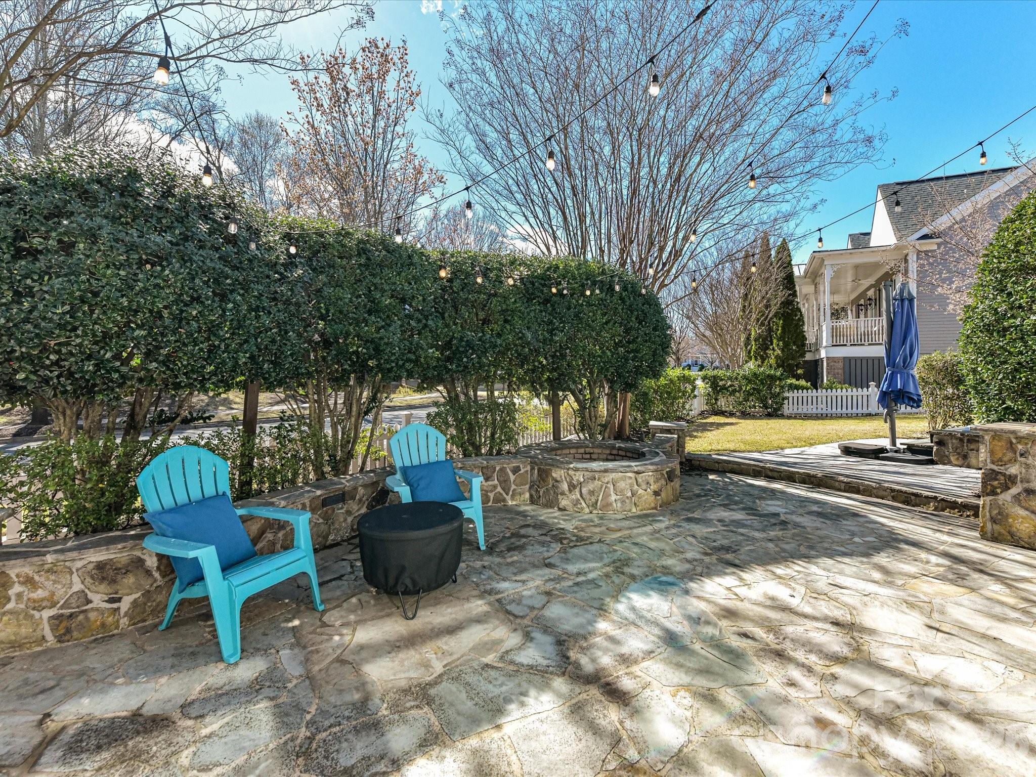 10030 Triple Oak Road Charlotte, NC 28277 - Photo 40 of 48 a view of a backyard with sitting area and tree