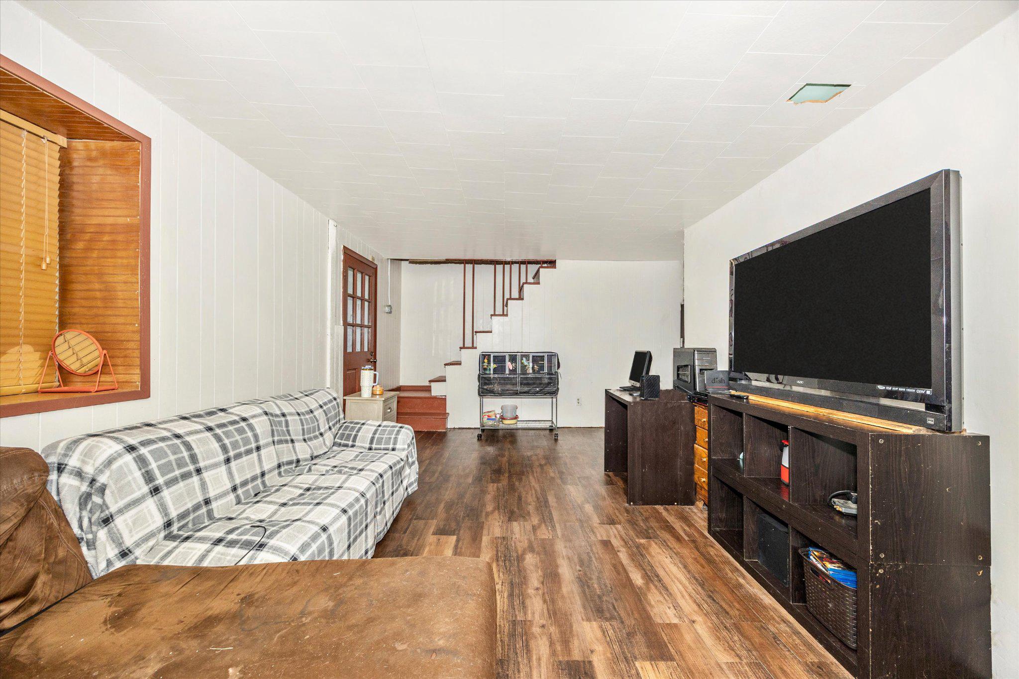 14721 Albert Staub Road Thurmont, MD 21788 - Photo 12 of 46 a living room with furniture and a flat screen tv