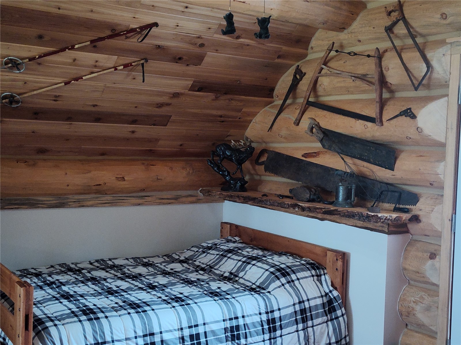 5 Arland Road Como, CO 80456 - Photo 25 of 33 a bed sitting in a bedroom next to a window