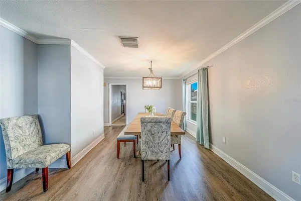 a room with wooden floor and a window