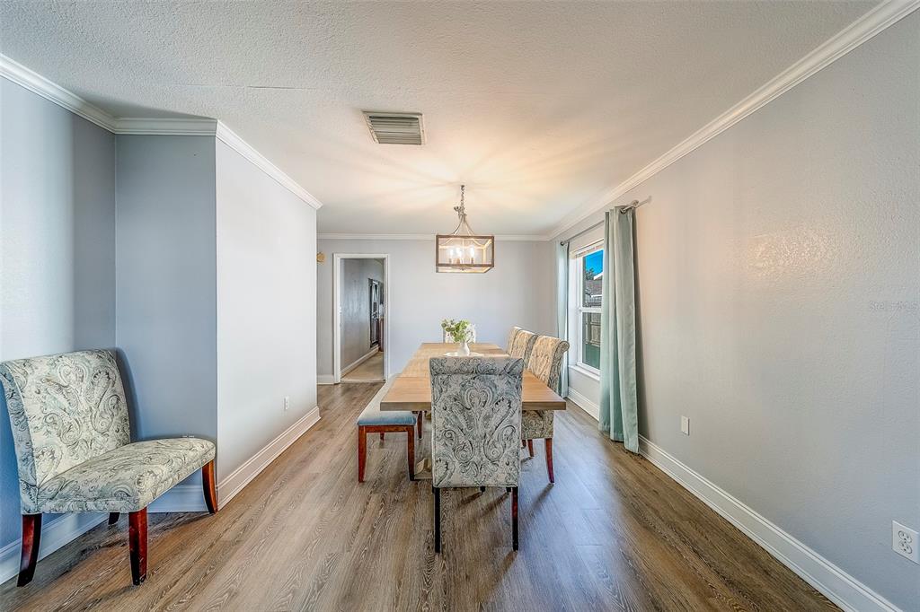 14414 91st Avenue North Seminole, FL 33776 - Photo 14 of 58 a living room with furniture and a wooden floor