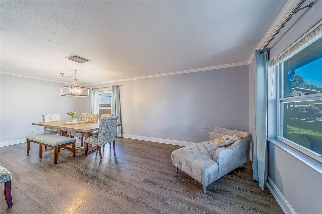 14414 91st Avenue North Seminole, FL 33776 - Photo 16 of 58 a living room with furniture and a wooden floor