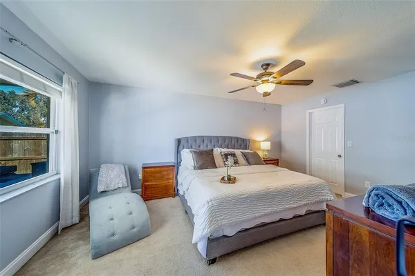 a spacious bathroom with a double vanity sink a mirror and a shower