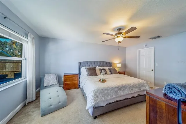 a spacious bathroom with a double vanity sink a mirror and a shower
