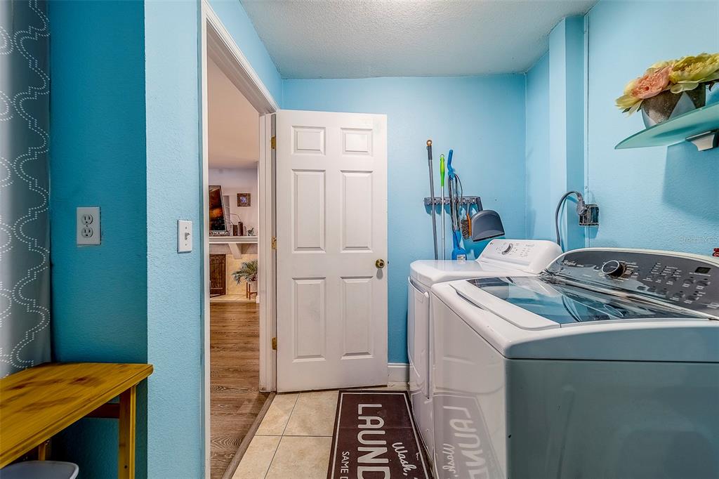 14414 91st Avenue North Seminole, FL 33776 - Photo 27 of 58 a kitchen that has a sink and a stove in it