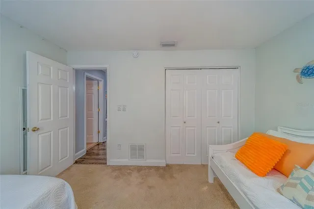 a bathroom with a sink a toilet a mirror and shower