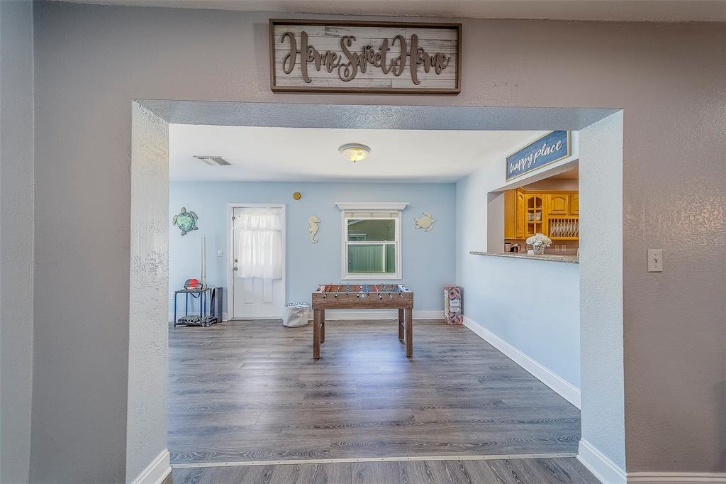 14414 91st Avenue North Seminole, FL 33776 - Photo 37 of 58 a living room with furniture and wooden floor