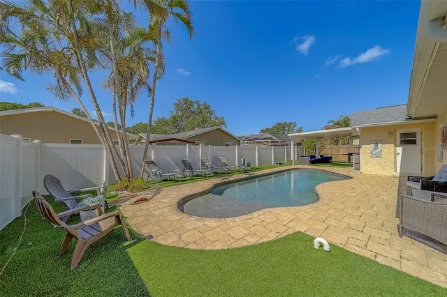 a view of swimming pool with a yard