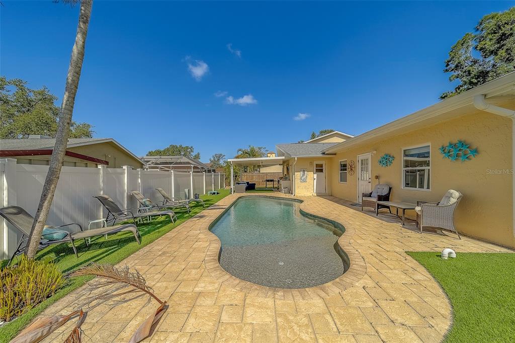 14414 91st Avenue North Seminole, FL 33776 - Photo 46 of 58 a view of a house with backyard