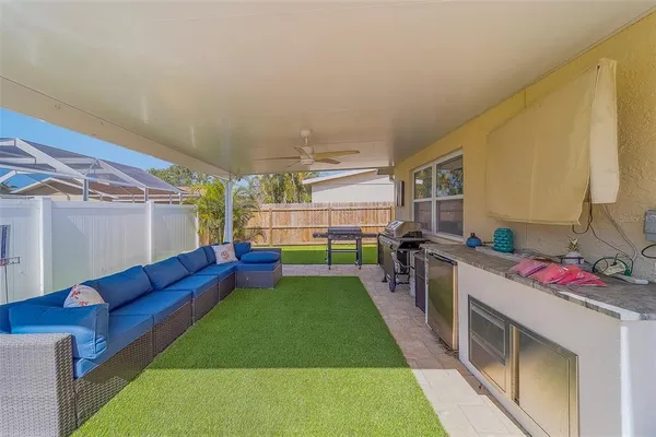 a view of a house with backyard and porch