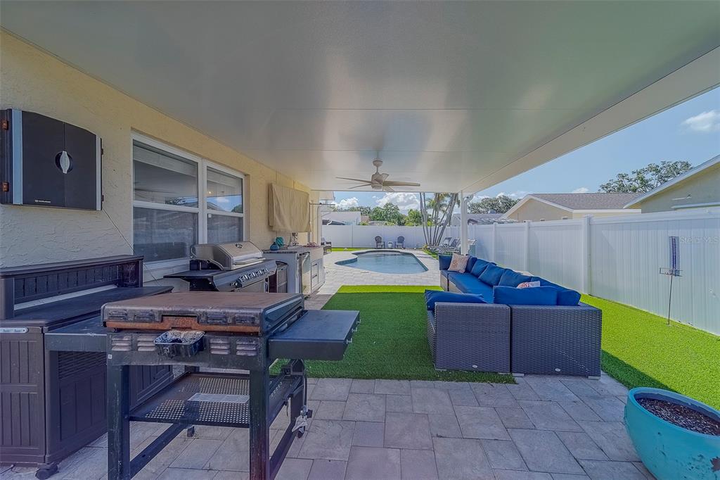 14414 91st Avenue North Seminole, FL 33776 - Photo 50 of 58 a view of a backyard with couches table and chairs