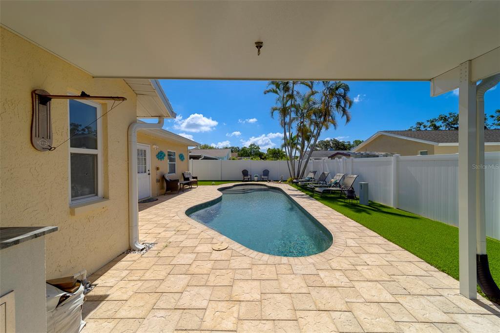 14414 91st Avenue North Seminole, FL 33776 - Photo 51 of 58 a swimming pool with a yard