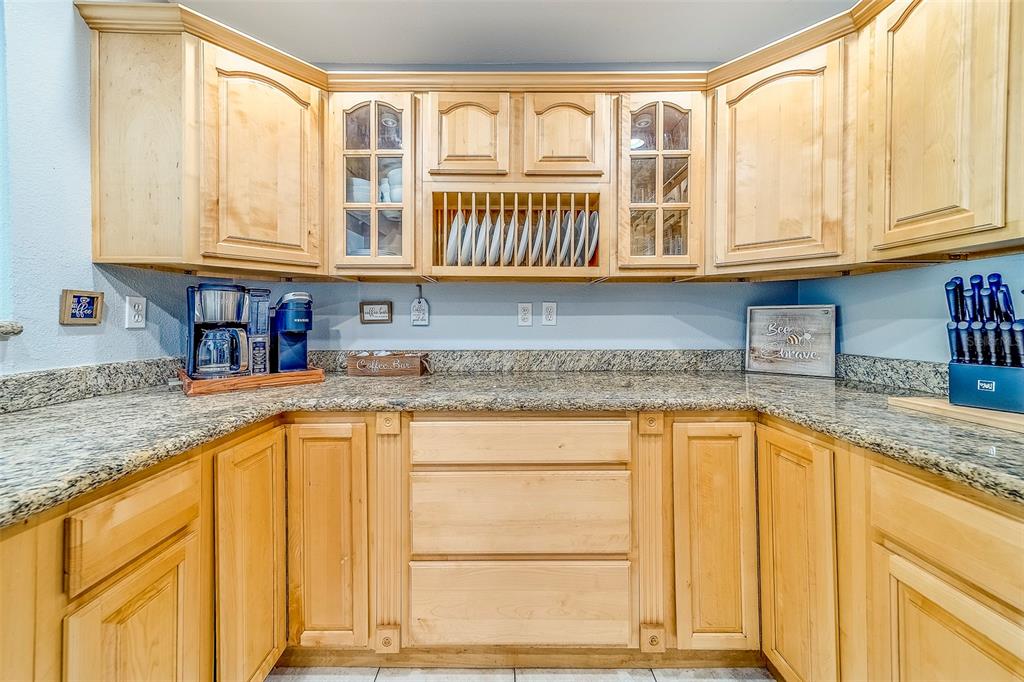 14414 91st Avenue North Seminole, FL 33776 - Photo 10 of 58 a kitchen with stainless steel appliances granite countertop a sink and cabinets