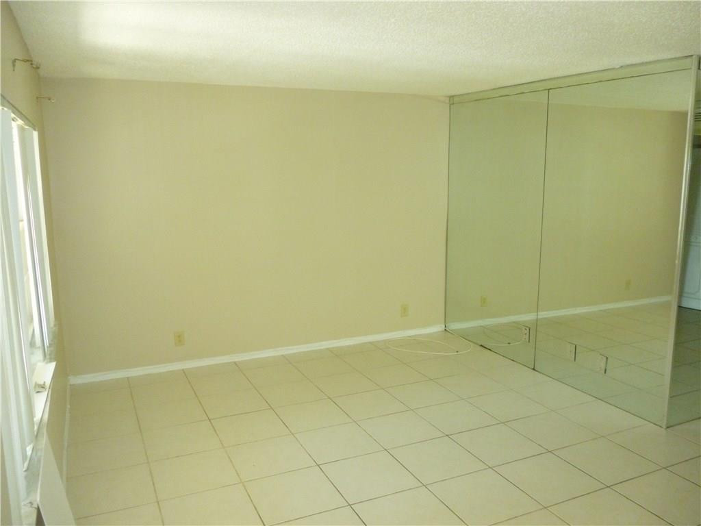 2131 Northeast 41st Street, Unit 107 Lighthouse Point, FL 33064 - Photo 11 of 18 a view of an empty room