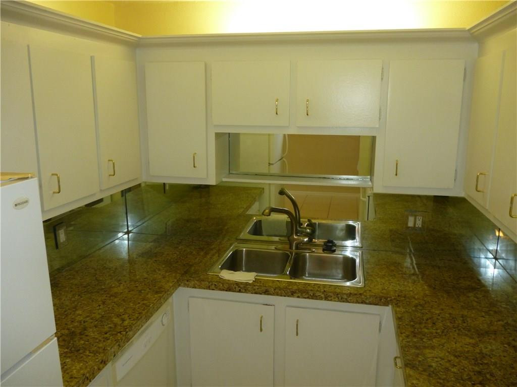 2131 Northeast 41st Street, Unit 107 Lighthouse Point, FL 33064 - Photo 12 of 18 a bathroom with a sink and a mirror