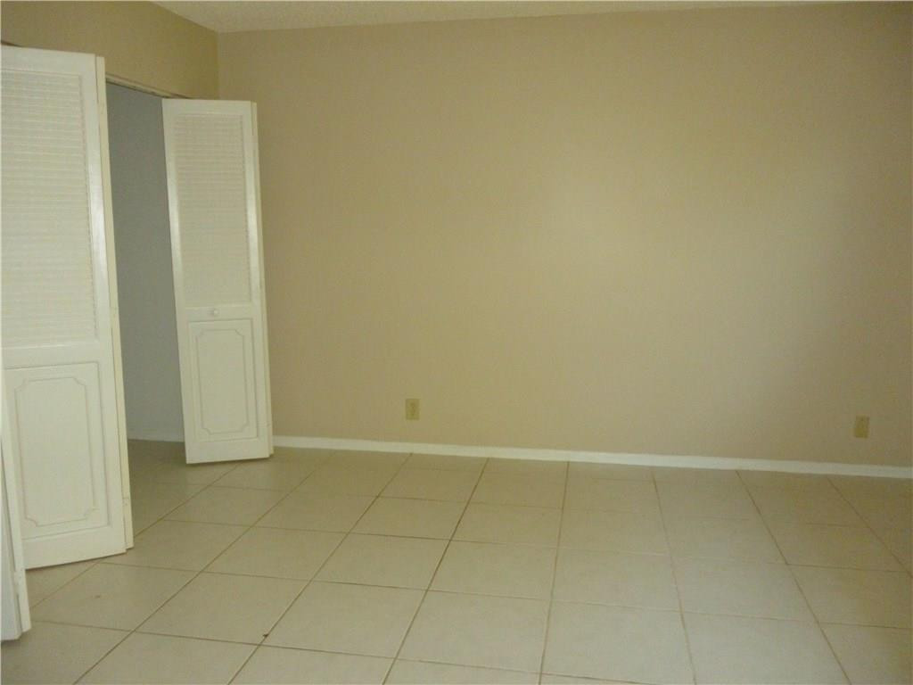 2131 Northeast 41st Street, Unit 107 Lighthouse Point, FL 33064 - Photo 18 of 18 a view of an empty room