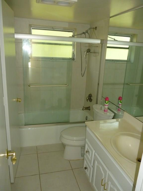 2131 Northeast 41st Street, Unit 107 Lighthouse Point, FL 33064 - Photo 6 of 18 a bathroom with a sink a toilet and shower