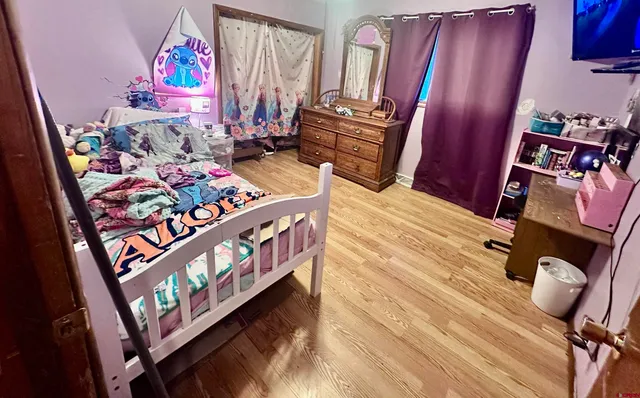 a bedroom with furniture and a window