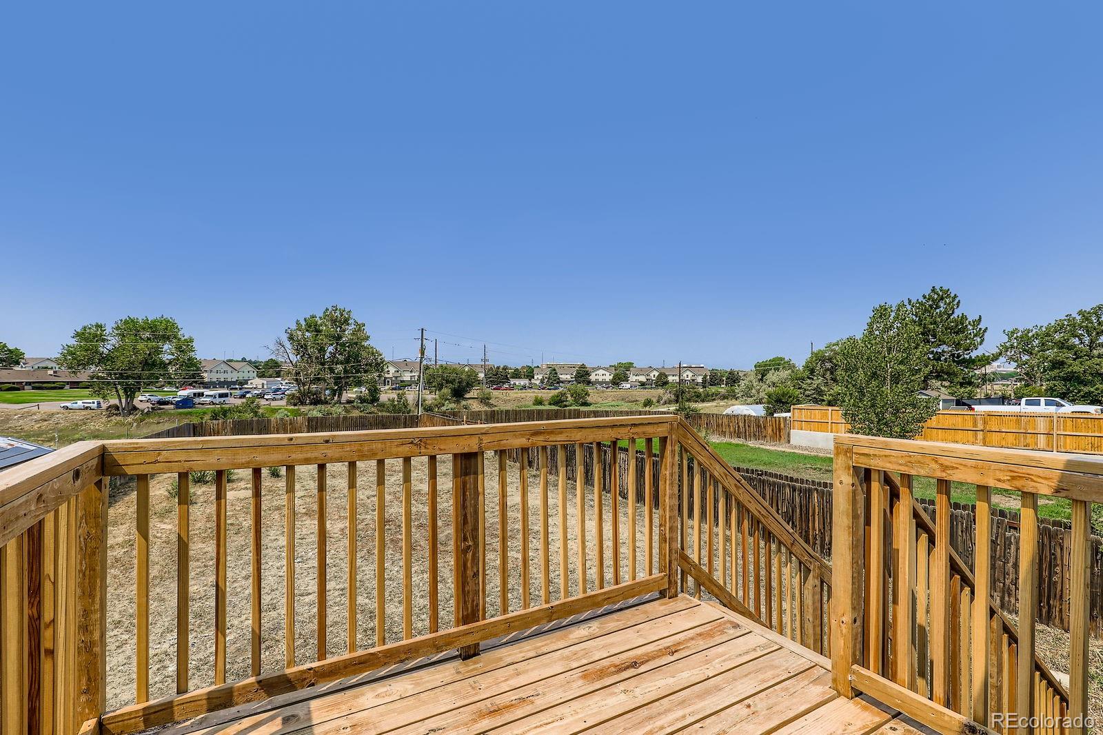 831 Sable Boulevard Aurora, CO 80011 - Photo 24 of 26 a view of city from a balcony
