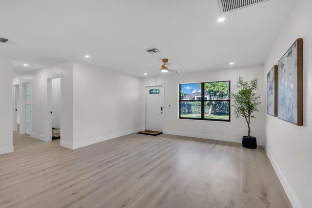 a living room with kitchen island granite countertop furniture and a fireplace