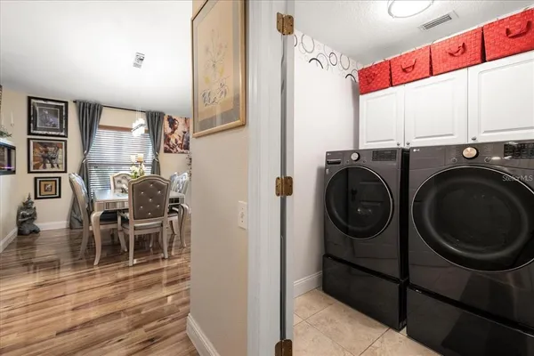 a view of a hallway with washer and dryer