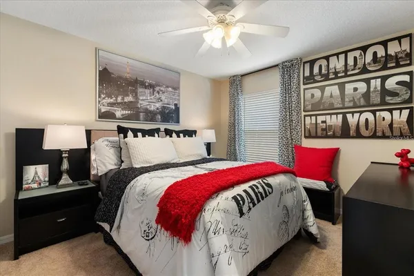 a bedroom with bed and a window