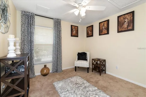 a view of a livingroom with furniture and workspace