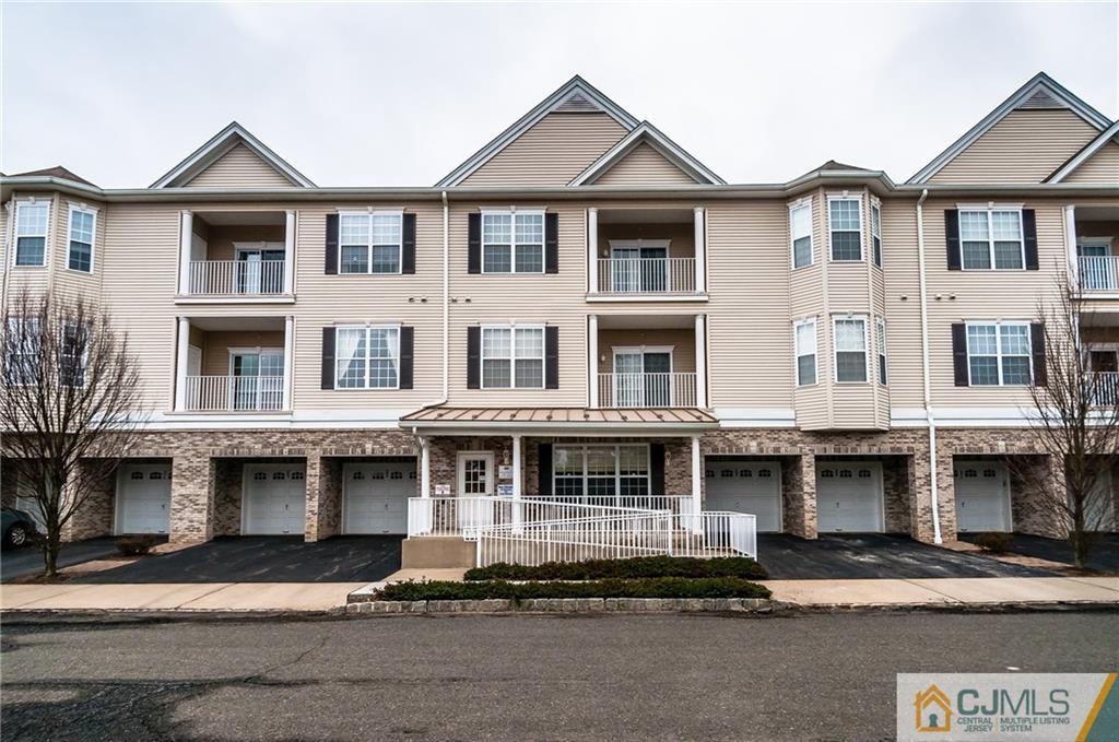 203 Potts Road Morganville, NJ 07751 - Photo 1 of 25 a front view of a houses with yard