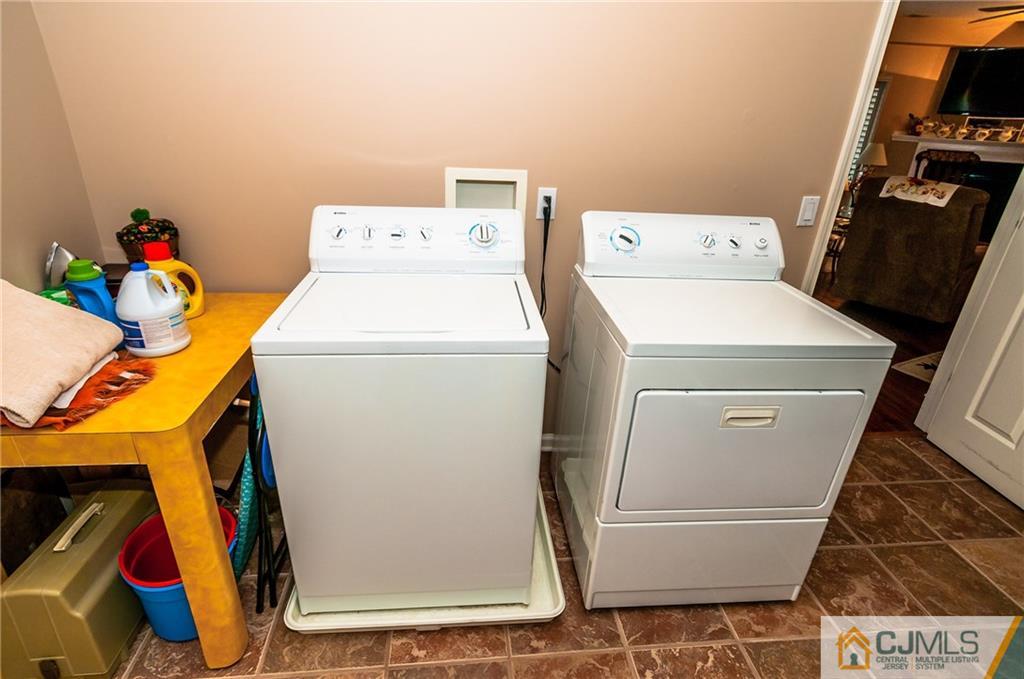 203 Potts Road Morganville, NJ 07751 - Photo 3 of 25 a utility room with dryer and washer