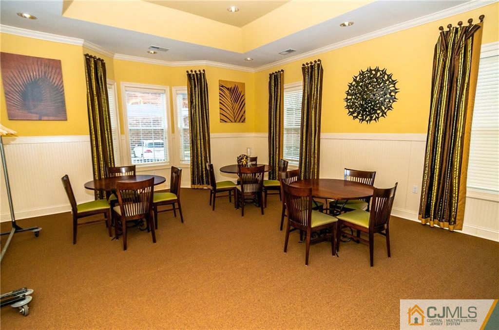 203 Potts Road Morganville, NJ 07751 - Photo 22 of 25 a view of a dining room with furniture and a window