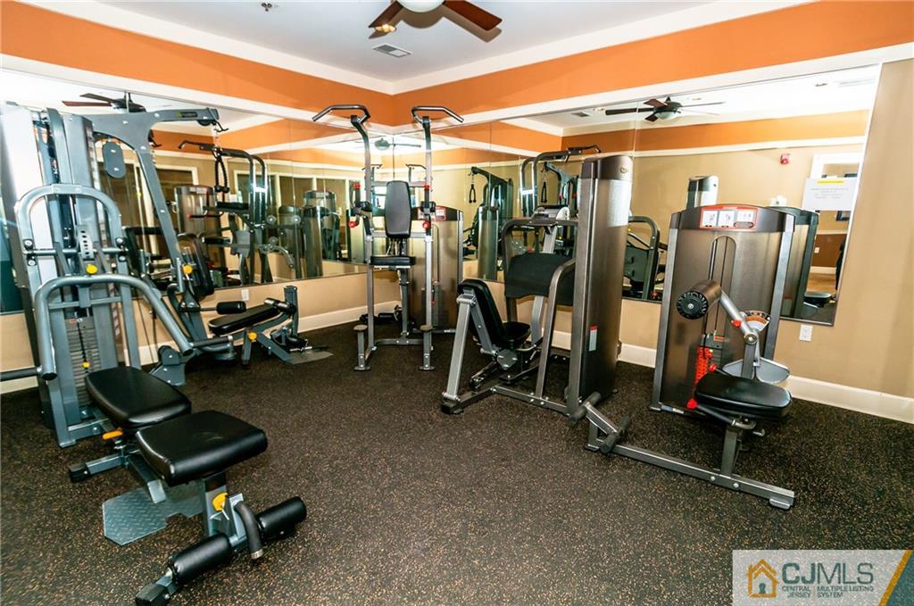 203 Potts Road Morganville, NJ 07751 - Photo 23 of 25 a view of a room with gym equipment
