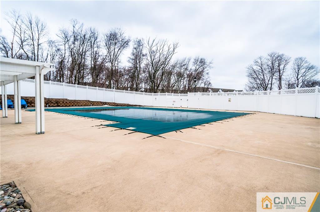 203 Potts Road Morganville, NJ 07751 - Photo 24 of 25 a view of an outdoor space and basketball court