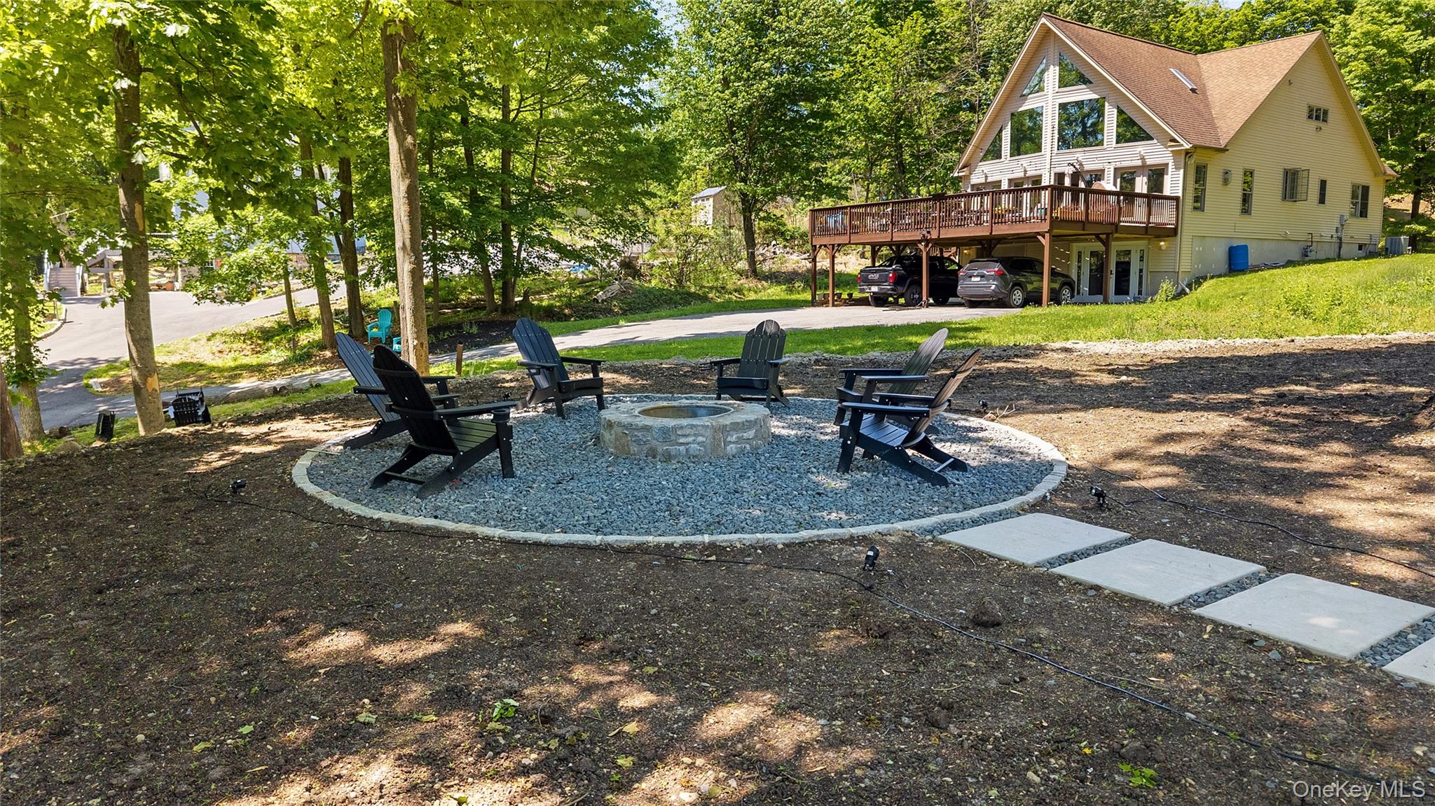 548 Lakes Road Monroe, NY 10950 - Photo 7 of 50 a view of a house with a yard patio and sitting area