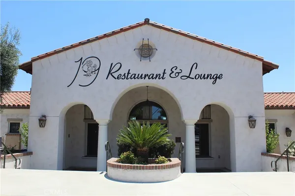 a view of lobby with two and potted plants