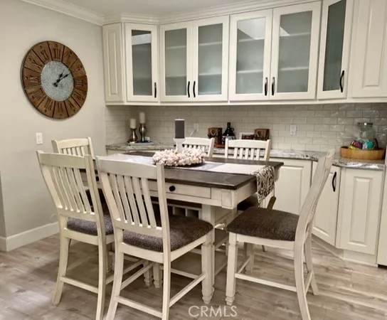 a kitchen with a dining table and chairs