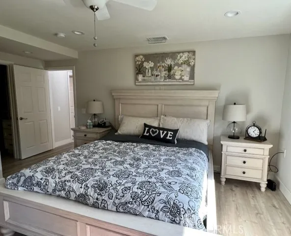 a bedroom with a bed and a dresser in it